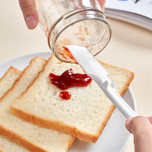 Charger l'image dans la galerie, Éplucheur de cuisine multifonctionnel avec manche orange et tête en silicone pour racler et étaler les sauces